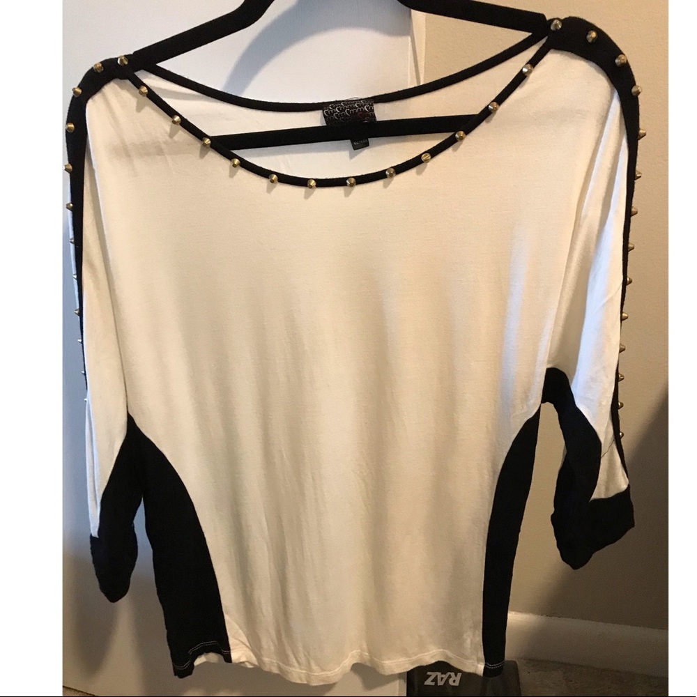 White top with black accents and gold studs